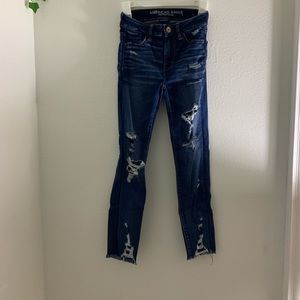 Dark wash jeans. Mildly distressed. Size 00 high rise. Skinny.